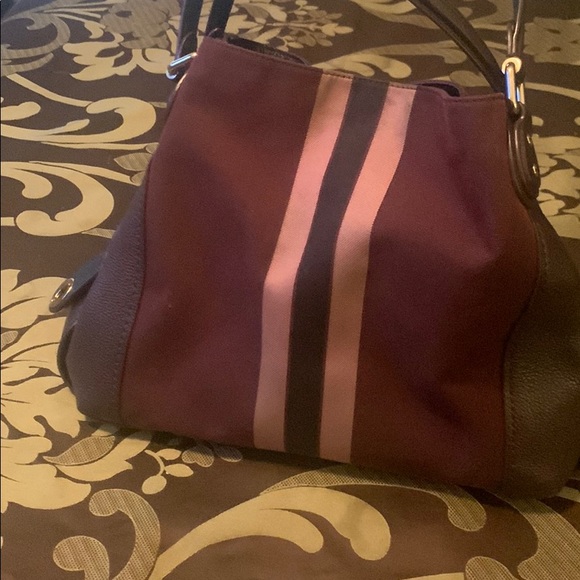 Coach multi colored purse with secured clasp